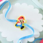 Super Mario Kids Rakhi With Colors & Snickers