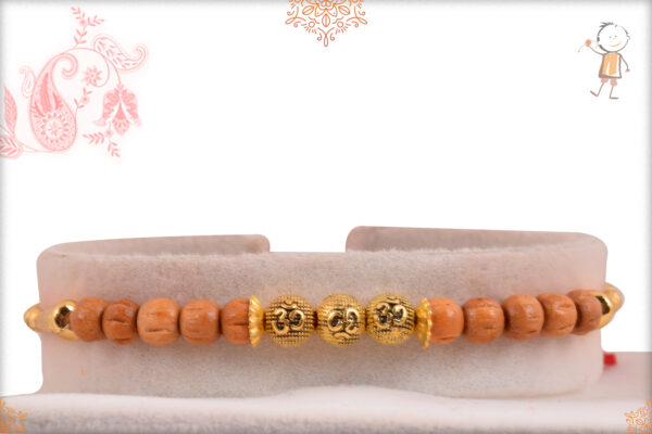 Delicate Golden OM with Sandalwood Beads Rakhi