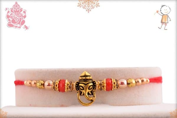 Divine Ganesh Rakhi with Red Beads