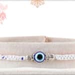 Delicate Evil Eye Rakhi with White and Blue Thread