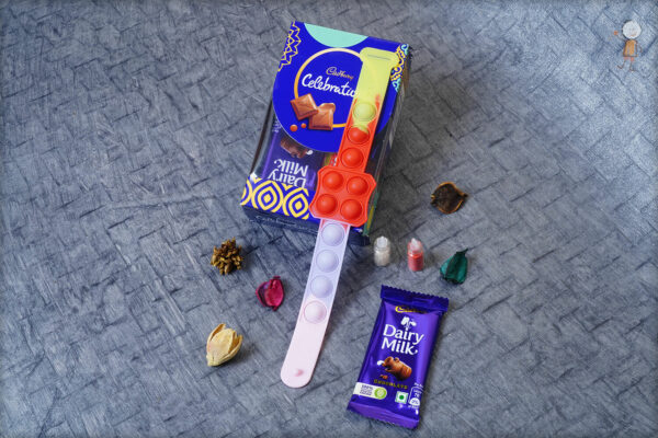 Multicolor Pop-it Kids Rakhi with Small Cadbury Celebrations